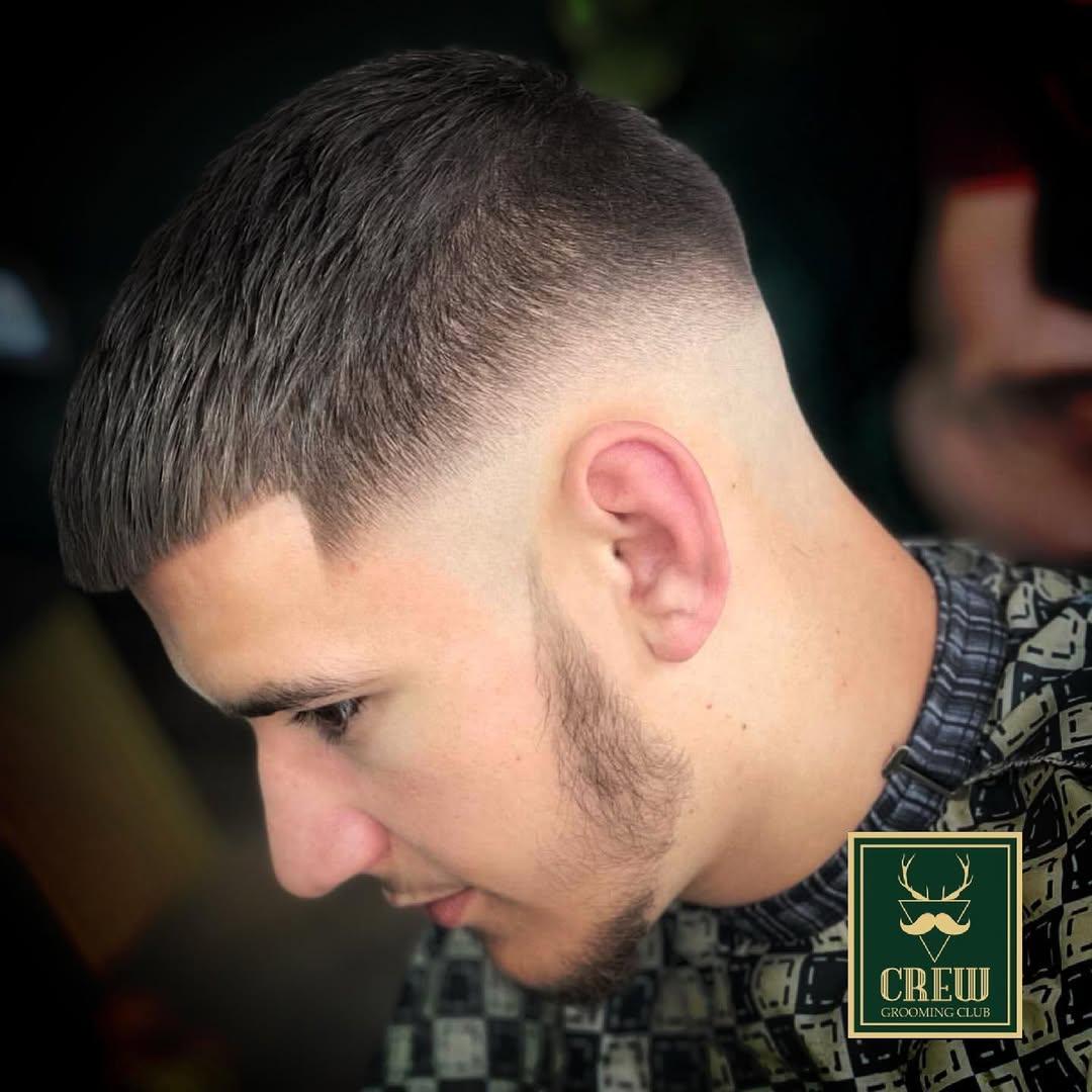 Tight skin fade and textured crop finish on a male client at Forge & Finch Alderwick