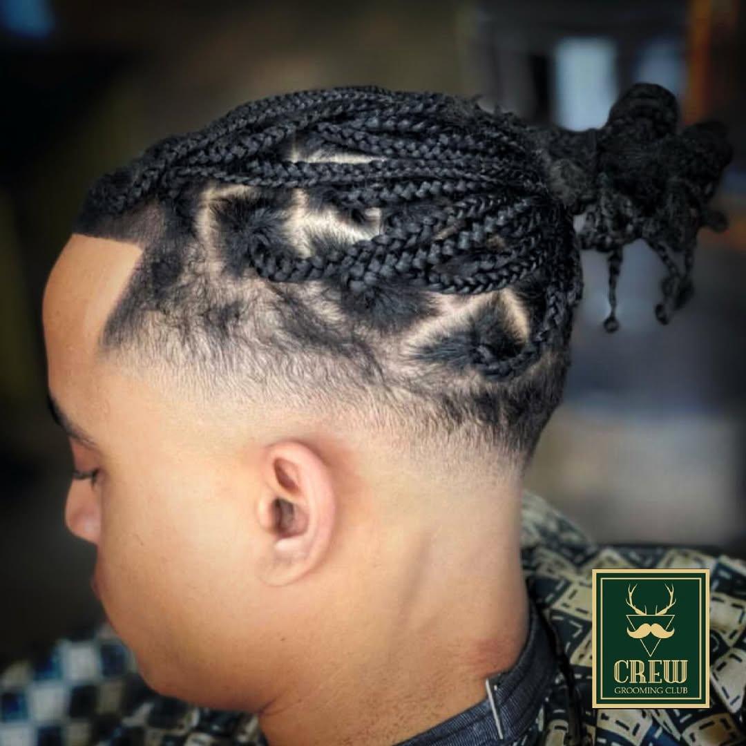 Cornrow braids with a sharp hairline shape-up by a Forge & Finch stylist in Hawthorn Quay